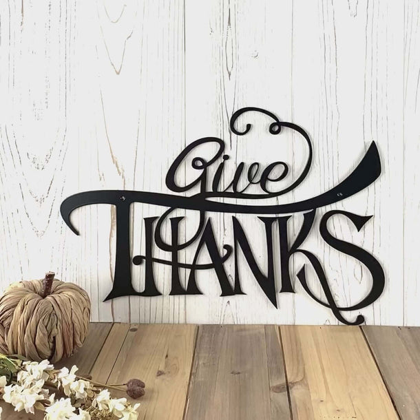 Video of give thanks metal wall art with scrolls, in matte black powder coat.