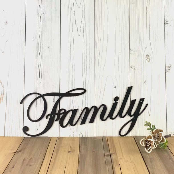 Video of cursive family metal wall art, in matte black powder coat.