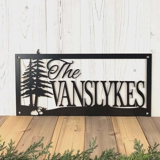 Video of personalized family name metal sign with pine trees, in matte black powder coat.
