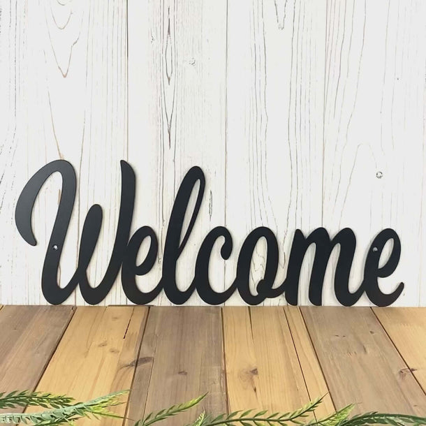 Video of Welcome script metal wall art, in matte black powder coat.