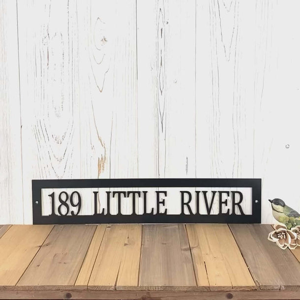 Video of rectangular personalized metal address plaque, in matte black powder coat.