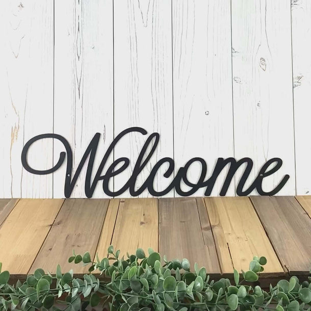 Video of Welcome script metal sign in matte black powder coat.