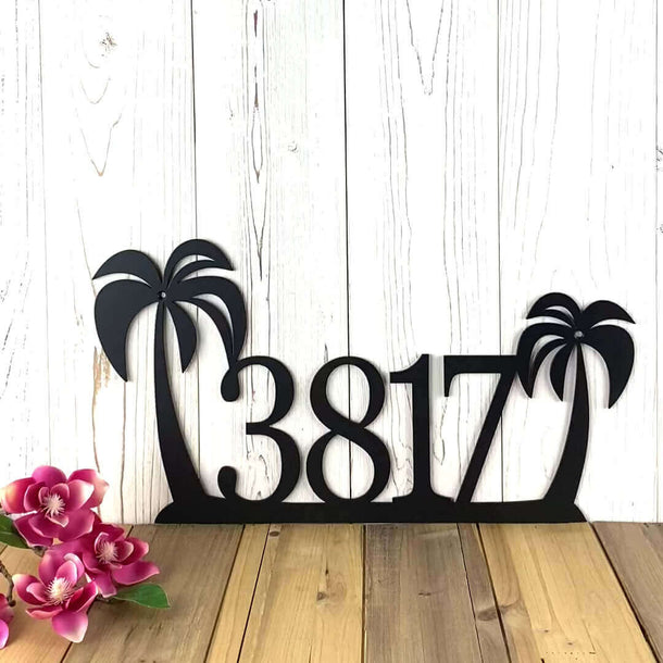 Video of horizontal metal house number sign with tropical palm trees, in matte black powder coat.