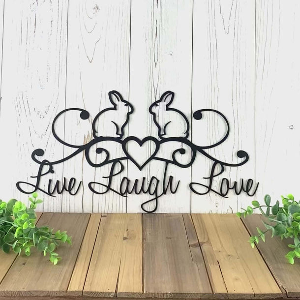 Video of Live Laugh Love metal wall art with Easter bunnies and heart, in matte black powder coat.