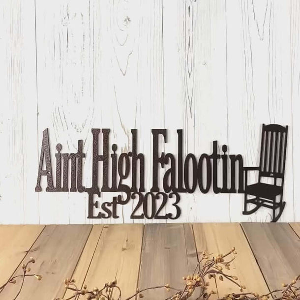 Video of Aint High Falootin family established year metal sign with rocking chair, in copper vein powder coat.