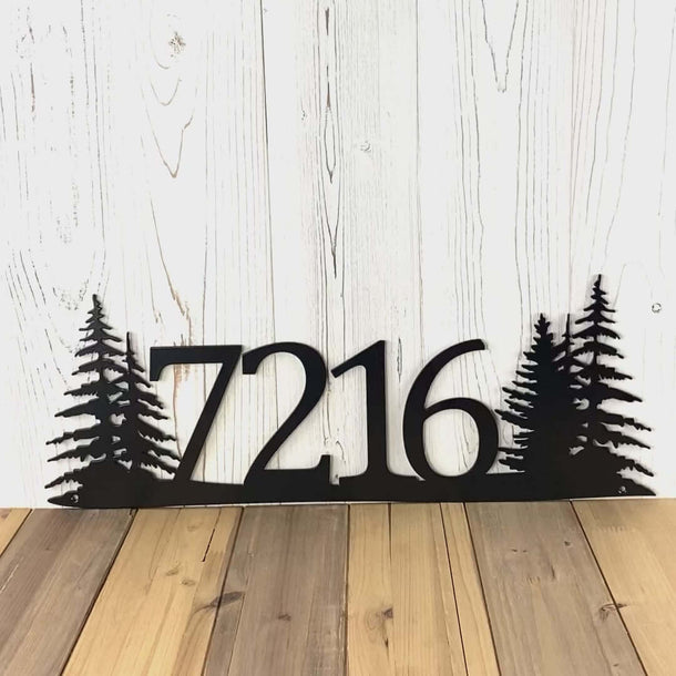 Video of horizontal metal house number sign with pine trees, in matte black powder coat.