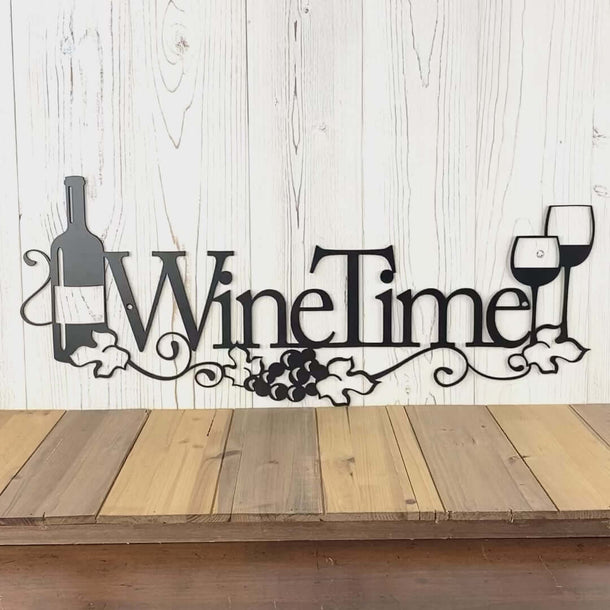 Video of Wine Time metal wall art with grapevines, grapes, wine bottle and glasses, in matte black powder coat.