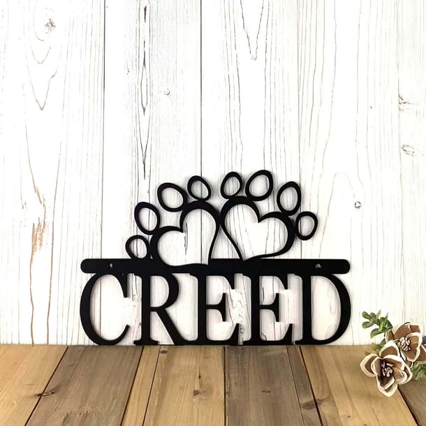 Video of custom dog name metal sign with heart dog paws, in matte black powder coat.