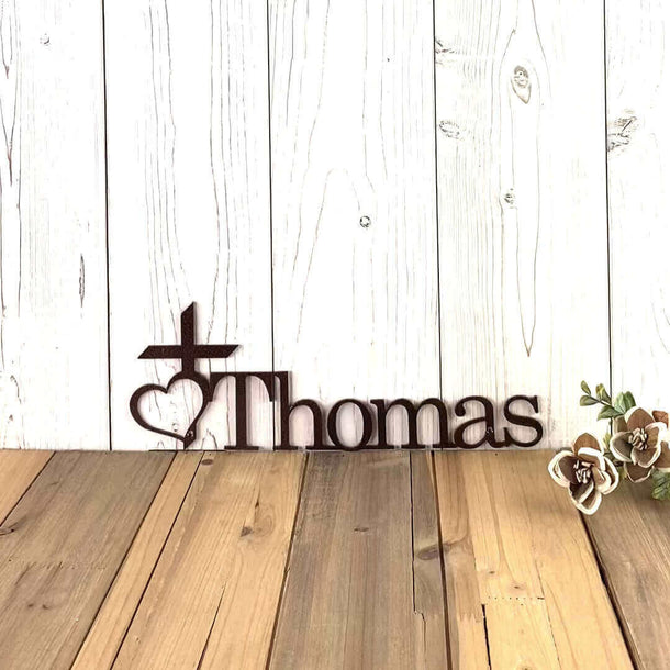 Video of personalized child name metal sign with religious cross and heart, in copper vein powder coat.