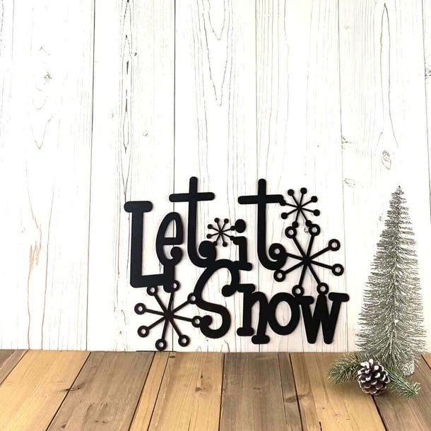 Video of Let it Snow metal wall art with cute snowflakes, in matte black powder coat.