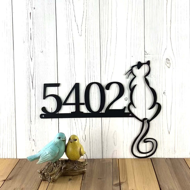 Video of horizontal metal house number sign with cat silhouette sitting on ledge, in matte black powder coat.