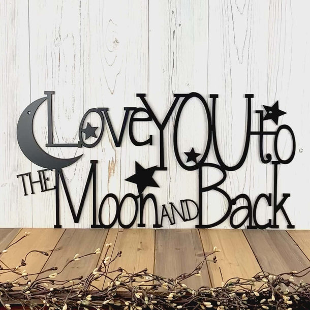 Video of Love me to the moon and back metal sign with stars and moon, in matte black powder coat.