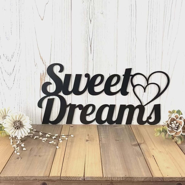 Video of Sweet dreams metal wall art, with two hearts, in matte black powder coat.