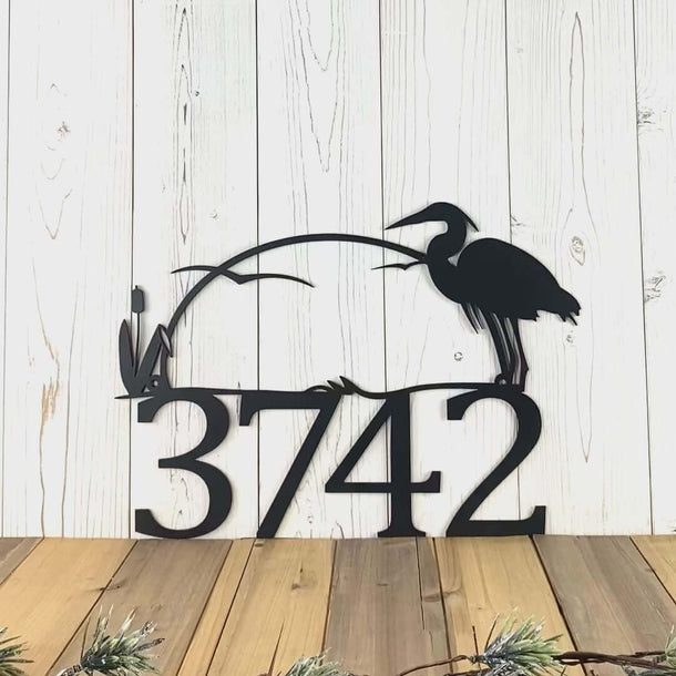 Video of custom metal house number sign with great blue heron and cattails lake sunset scene, in matte black powder coat.