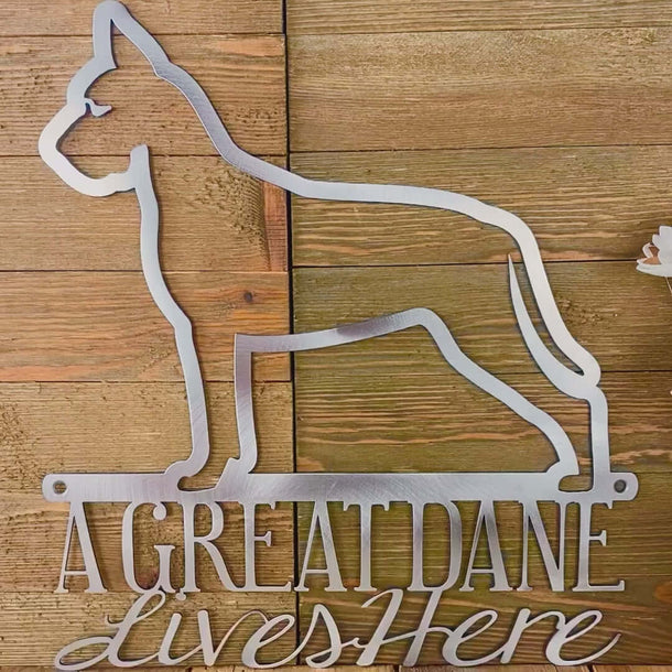 Video of Great Dane lives here metal wall art, in raw steel.