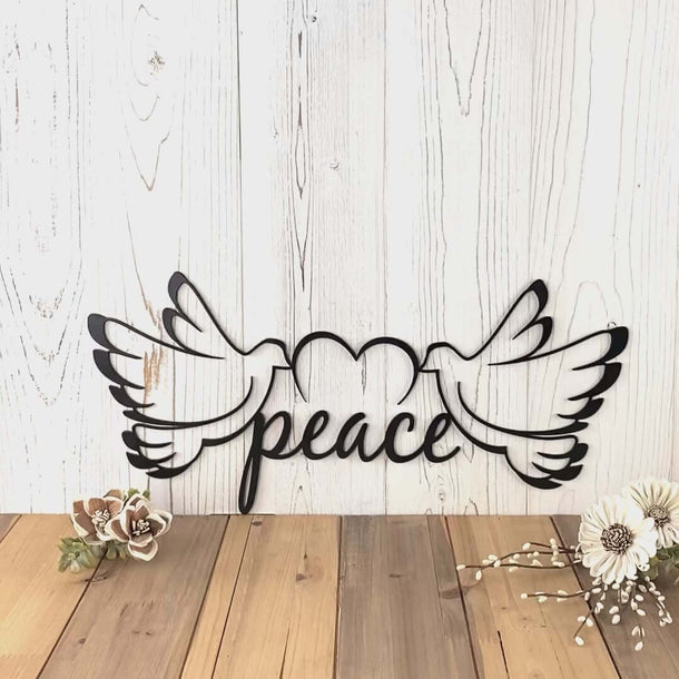 Video of Peace doves metal wall art, with a heart, in matte black powder coat.