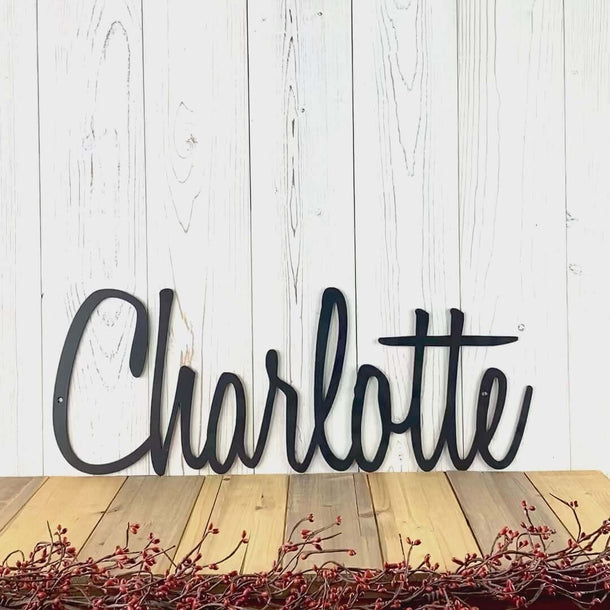 Video of cursive personalized name metal sign, in matte black powder coat.