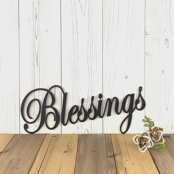 Video of cursive Blessings metal wall art, in matte black powder coat.
