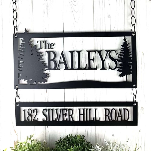 Video of personalized family name and address metal signs, with pine trees, in matte black powder coat.