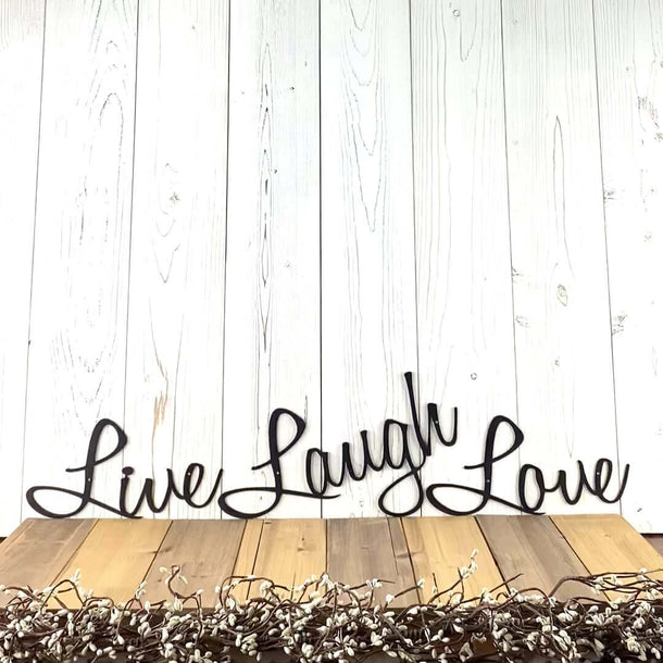 Video of Live Laugh Love script metal signs, in matte black powder coat.