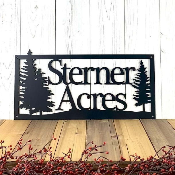 Video of personalized family last name metal sign, with pine trees, in matte black powder coat.