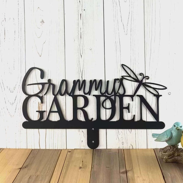 Video of personalized garden name metal yard sign with a dragonfly, in matte black powder coat.