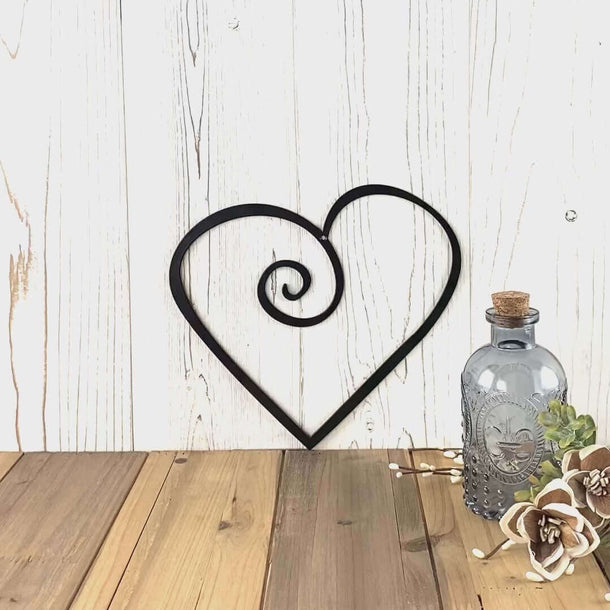Video of curly heart metal wall art, in matte black powder coat.