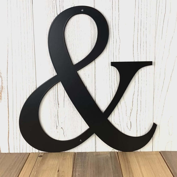 Video of Ampersand metal wall art, in matte black powder coat.