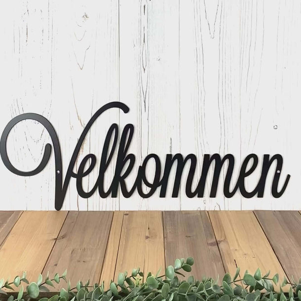 Video of Velkommen welcome script metal sign, in matte black powder coat.