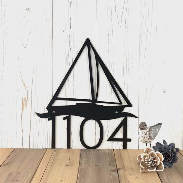 Video of sailboat metal house number sign, in matte black powder coat.