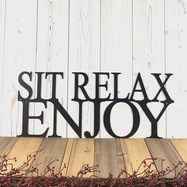 Video of Sit relax enjoy metal wall art, in matte black powder coat.