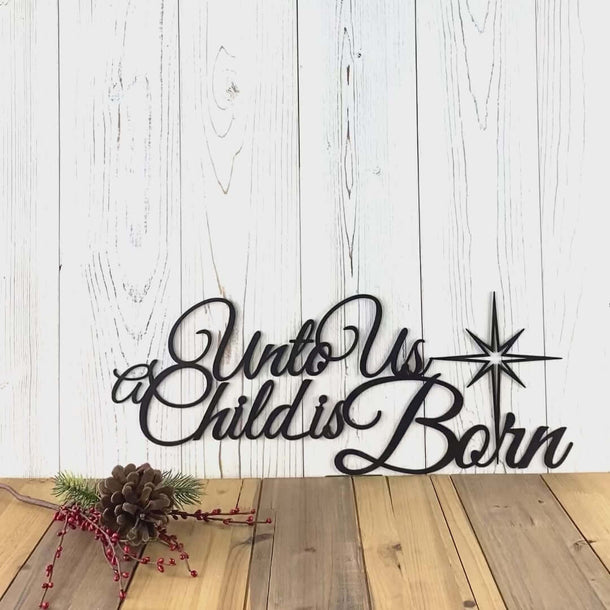 Video of Unto us a child is born metal sign with Christmas star, in matte black powder coat.