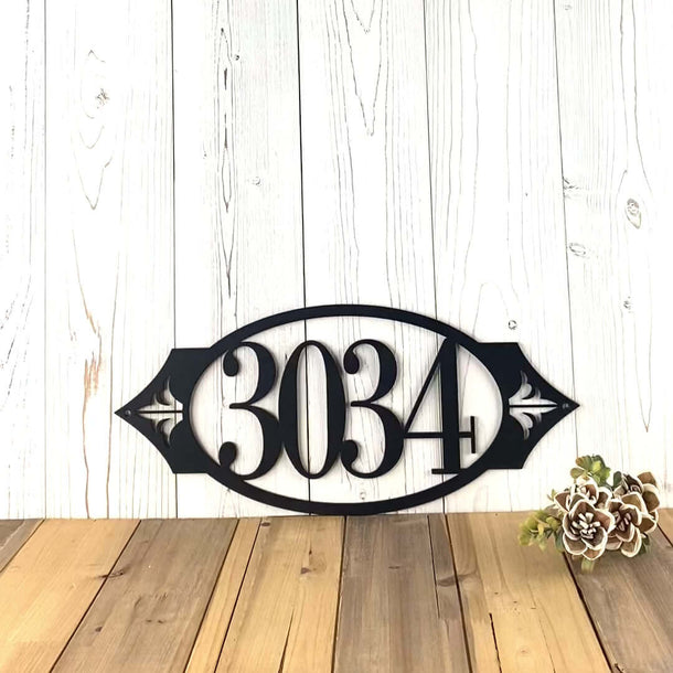 Video of horizontal oval metal house number sign with fleur-de-lis, in matte black powder coat.