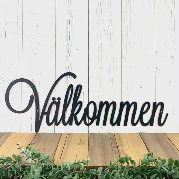 Välkommen welcome script metal wall art, in matte black powder coat.