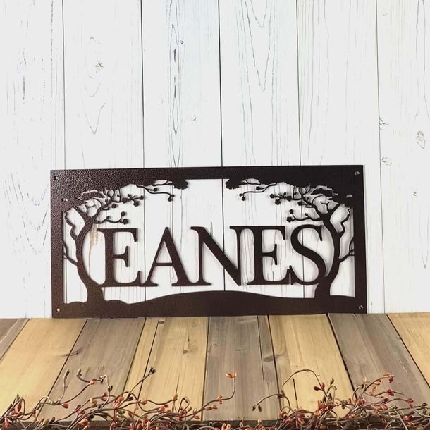 Video of personalized house villa name metal sign with cherry trees, in copper vein powder coat.
